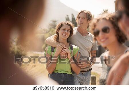 Stock Photograph - Group of friends standing together, outdoors. Fotosearch