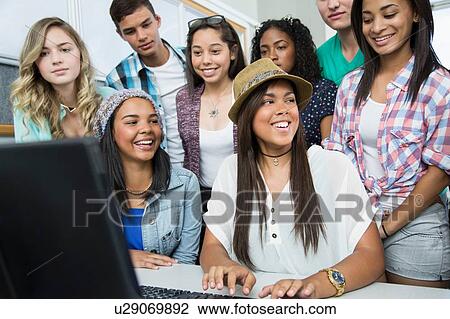 Group of teenagers working on computer in high school class View Large Photo Image Stock Image - Group of teenagers working on computer in high school class. Fotosearch