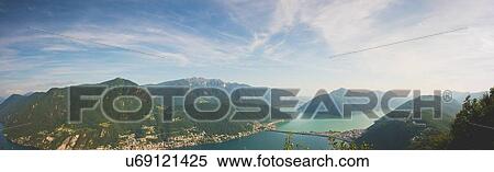 High angle panoramic view of Lake Lugano, Switzerland View Large Photo Image Stock Photography - High angle panoramic view of Lake Lugano, Switzerland. Fotosearch