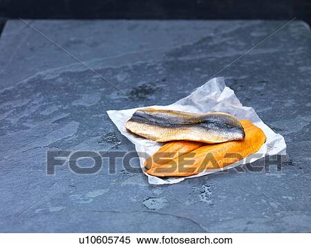 High angle view of raw Scottish kipper fillets on baking paper and slate View Large Photo Image Stock Photography - High angle view of raw Scottish kipper fillets on baking paper and slate. Fotosearch