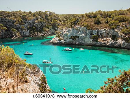 High angle view of yachts anchored at Cala Macarella, Menorca, Spain View Large Photo Image Stock Photo - High angle view of yachts anchored at Cala Macarella, Menorca, Spain. Fotosearch