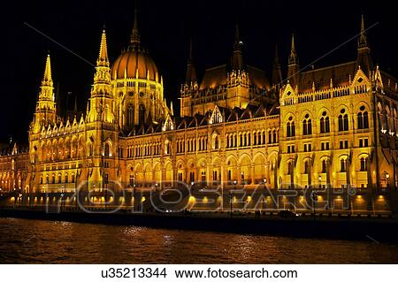 Hungarian Parliament at night, Danube River in foreground, Budapest, Hungary View Large Photo Image Picture - Hungarian Parliament at night, Danube River in foreground, Budapest, Hungary. Fotosearch