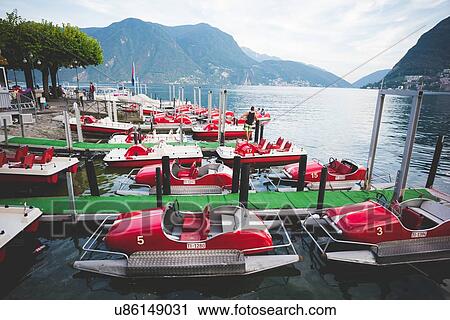 Stock Image - Moored pedalos, Lake Lugano, Switzerland. Fotosearch