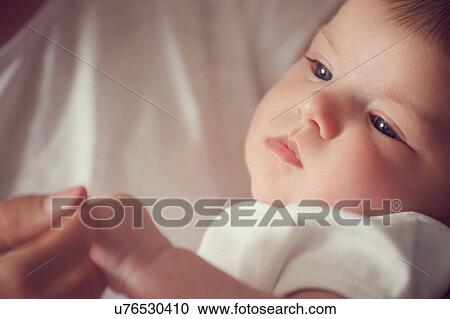 Mother holding baby's fingers View Large Photo Image Stock Image - Mother holding baby's fingers. Fotosearch