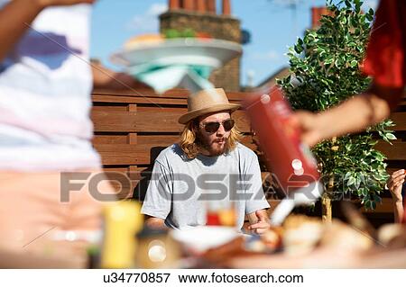 Stock Photo - People at a rooftop party. Fotosearch