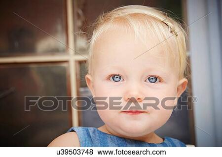 Portrait of cute blonde baby girl looking at camera View Large Photo Image Stock Photo - Portrait of cute blonde baby girl looking at camera. Fotosearch