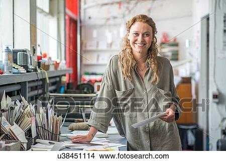 Picture - Portrait of female print designer in workshop. Fotosearch