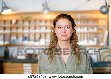 Stock Image - Portrait of female printer in letterpress workshop. Fotosearch