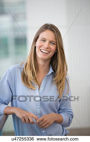 Portrait of happy young businesswoman outside office View Large Photo Image Stock Photograph - Portrait of happy young businesswoman outside office. Fotosearch