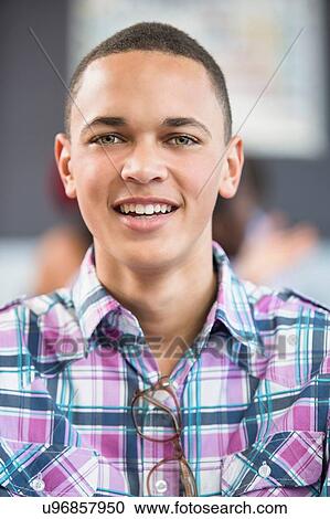 Portrait of male student in classroom View Large Photo Image Stock Image - Portrait of male student in classroom. Fotosearch