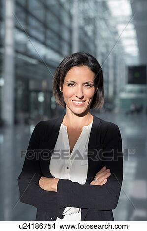 Portrait of mature businesswoman at airport View Large Photo Image Picture - Portrait of mature businesswoman at airport. Fotosearch