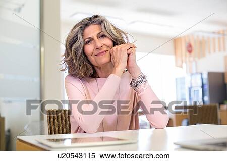 Portrait of senior female designer in office View Large Photo Image Stock Photography - Portrait of senior female designer in office. Fotosearch