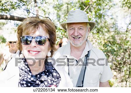 Picture - Portrait of senior man and wife on safari in Zambia. Fotosearch