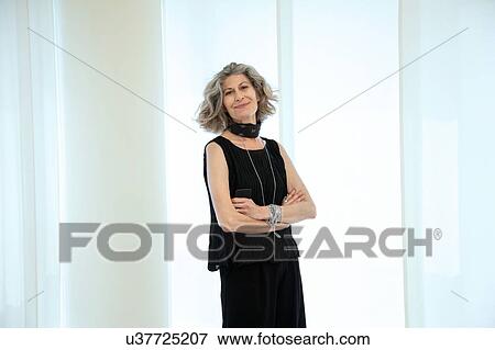 Portrait of stylish senior female designer in office View Large Photo Image Stock Photo - Portrait of stylish senior female designer in office. Fotosearch