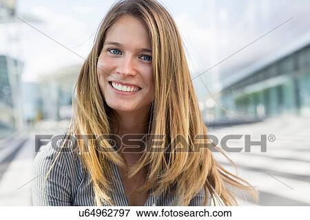 Portrait of young businesswoman with long blond hair View Large Photo Image Stock Photo - Portrait of young businesswoman with long blond hair. Fotosearch