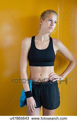Portrait of young woman, wearing sports clothing View Large Photo Image Stock Image - Portrait of young woman, wearing sports clothing. Fotosearch
