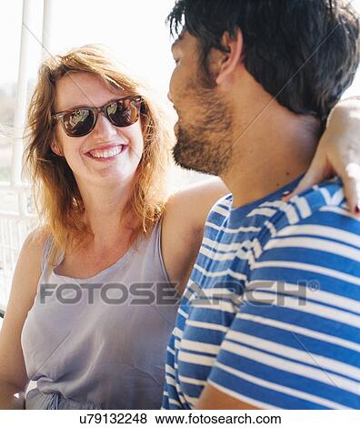 Portrait of young woman with arm around boyfriend View Large Photo Image Stock Photo - Portrait of young woman with arm around boyfriend. Fotosearch