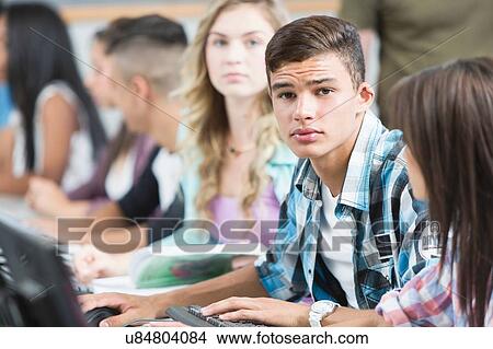 Row of high school students doing schoolwork View Large Photo Image Picture - Row of high school students doing schoolwork. Fotosearch