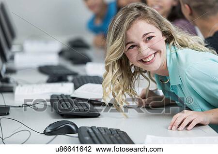 Row of high school students laughing in class View Large Photo Image Stock Image - Row of high school students laughing in class. Fotosearch
