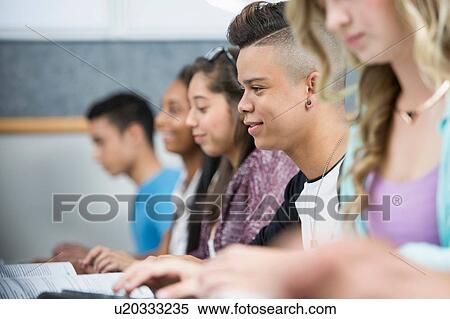 Row of teenage high school students in computer class View Large Photo Image Stock Photography - Row of teenage high school students in computer class. Fotosearch