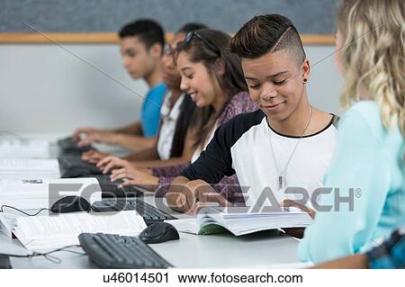 Row of teenage high school students working together in computer class View Large Photo Image Stock Image - Row of teenage high school students working together in computer class. Fotosearch