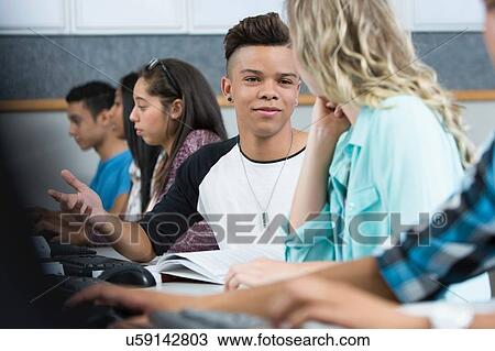 Row of teenage high school students talking in computer class View Large Photo Image Stock Image - Row of teenage high school students talking in computer class. Fotosearch