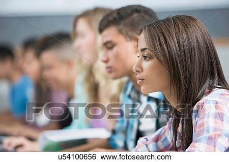 Row of teenage high school students working on computers View Large Photo Image Stock Photograph - Row of teenage high school students working on computers. Fotosearch