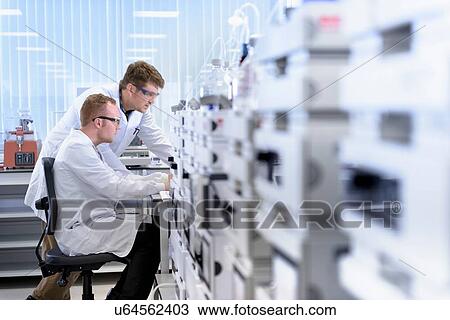 Scientists testing samples in laboratory View Large Photo Image Stock Image - Scientists testing samples in laboratory. Fotosearch