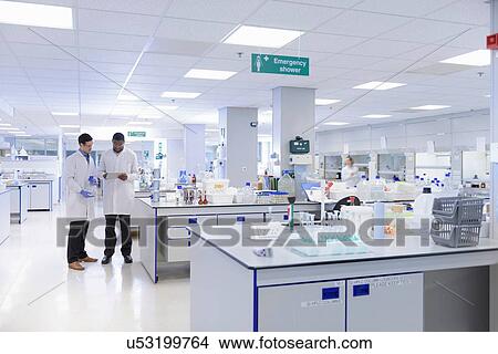 Scientists working in testing laboratory, wide angle view View Large Photo Image Picture - Scientists working in testing laboratory, wide angle view. Fotosearch
