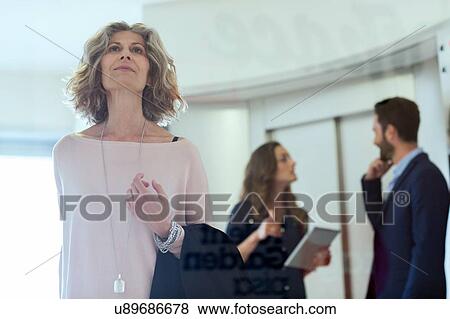 Senior businesswoman in office lobby View Large Photo Image Stock Photo - Senior businesswoman in office lobby. Fotosearch