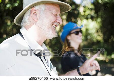 Stock Photography - Senior man and daughter on safari in Zambia. Fotosearch
