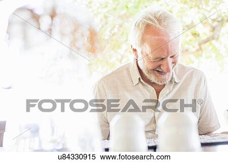 Senior man reading menu at safari lodge, Kafue National Park, Zambia View Large Photo Image Stock Photography - Senior man reading menu at safari lodge, Kafue National Park, Zambia. Fotosearch
