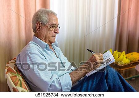 Senior man writing in notebook View Large Photo Image Picture - Senior man writing in notebook. Fotosearch