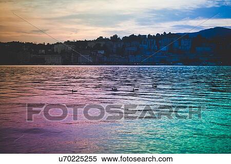 Silhouetted sunset, Lake Lugano, Switzerland View Large Photo Image Stock Photography - Silhouetted sunset, Lake Lugano, Switzerland. Fotosearch