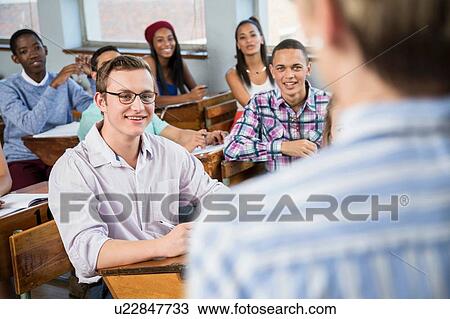 Students in classroom, listening to teacher View Large Photo Image Stock Image - Students in classroom, listening to teacher. Fotosearch