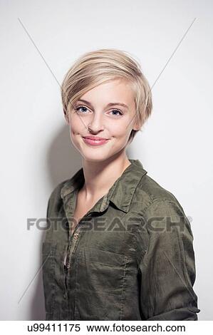 Studio portrait of happy young blond woman View Large Photo Image Stock Photography - Studio portrait of happy young blond woman. Fotosearch