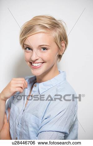 Studio portrait of pretty young woman with short blond hair View Large Photo Image Stock Photograph - Studio portrait of pretty young woman with short blond hair. Fotosearch
