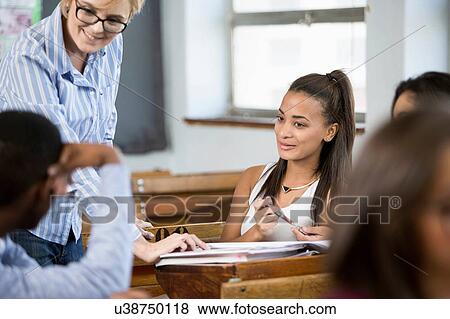 Teacher addressing students in classroom View Large Photo Image Stock Photo - Teacher addressing students in classroom. Fotosearch