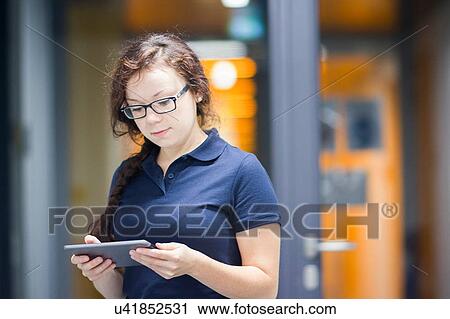 Stock Image - Technician using digital tablet in laboratory. Fotosearch