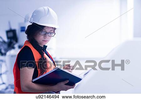 Technician working in factory View Large Photo Image Picture - Technician working in factory. Fotosearch