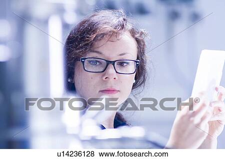 Technician working in laboratory View Large Photo Image Stock Photo - Technician working in laboratory. Fotosearch