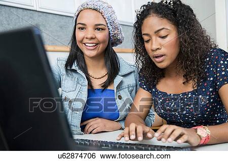 Two teenage girls in high school computer class View Large Photo Image Stock Photograph - Two teenage girls in high school computer class. Fotosearch