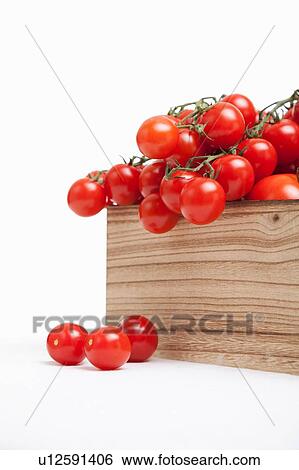 Stock Photograph - Wood crate filled with fresh vine tomatoes. Fotosearch