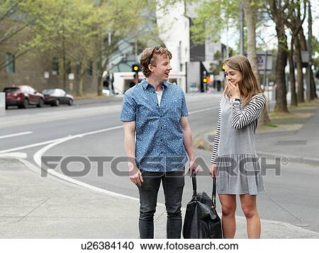Young couple carrying bag together on street, Melbourne, Victoria, Australia View Large Photo Image Stock Image - Young couple carrying bag together on street, Melbourne, Victoria, Australia. Fotosearch