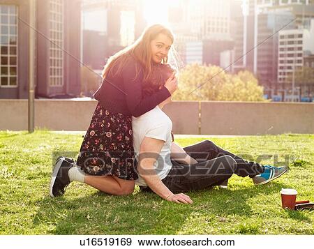 Young couple having coffee break on grass, Melbourne, Victoria, Australia View Large Photo Image Stock Photo - Young couple having coffee break on grass, Melbourne, Victoria, Australia. Fotosearch