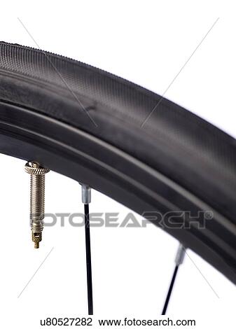 Bicycle tyre valve, close up. View Large Illustration Drawing - Bicycle tyre valve, close up.. Fotosearch