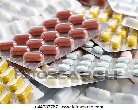 Stock Illustration - Blister packs containing various tablets. close up.. Fotosearch