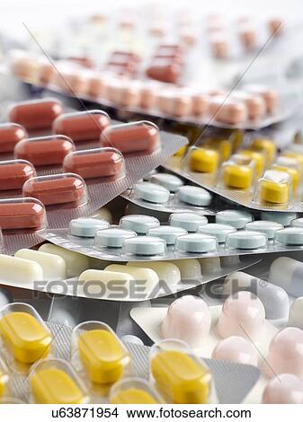 Stock Illustration - Blister packs containing various tablets. close up.. Fotosearch