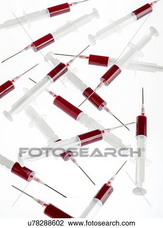 Blood samples in syringes against a white background. View Large Illustration Drawing - Blood samples in syringes against a white background.. Fotosearch