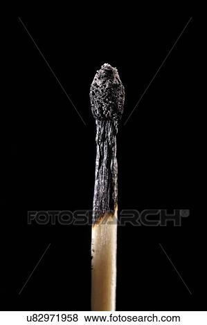 Stock Illustration - Burnt matchstick against a black background.. Fotosearch